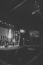 Black and white photo capturing the four band members of phlush in a raw, candid moment during rehearsal.