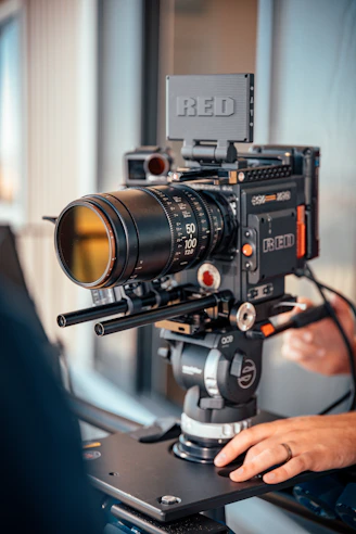black and silver camera on brown wooden table