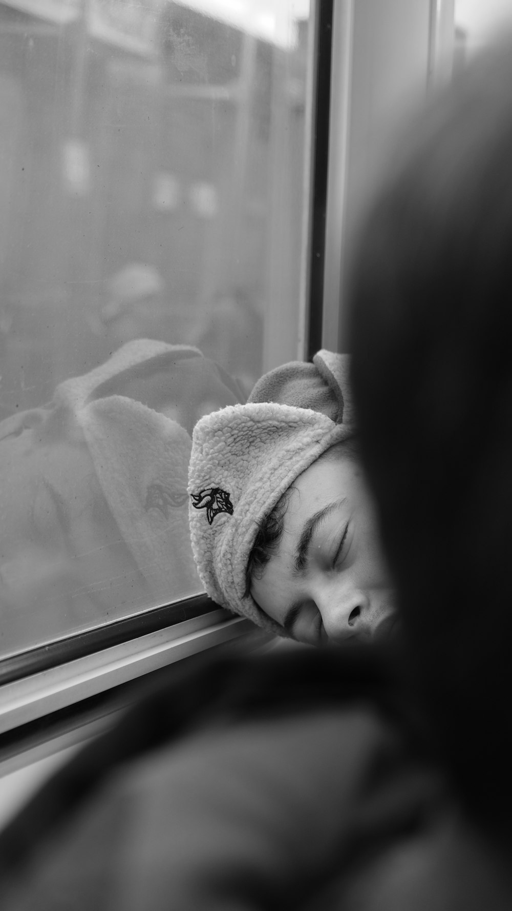 grayscale photo of baby wrapped in blanket