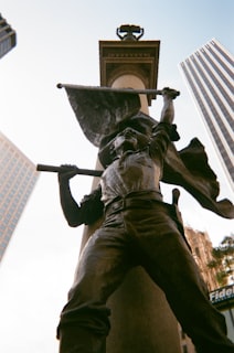 man holding a sword statue