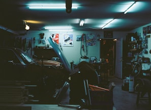 A well-organized garage with various car parts and tools.