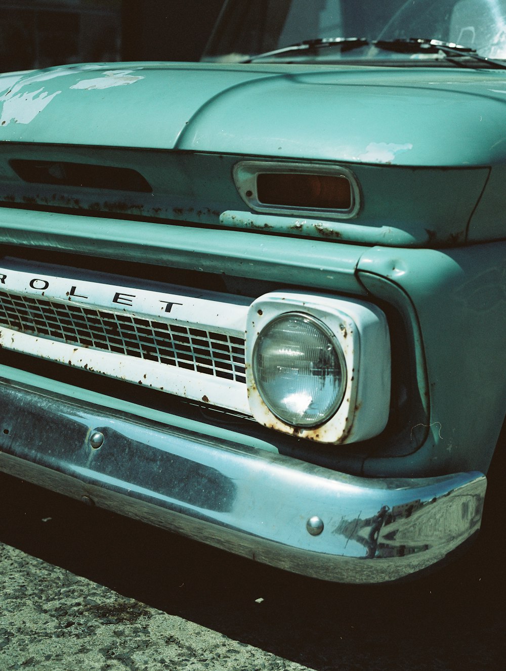 blue car with white and black license plate