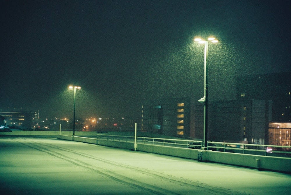 gray concrete road during night time