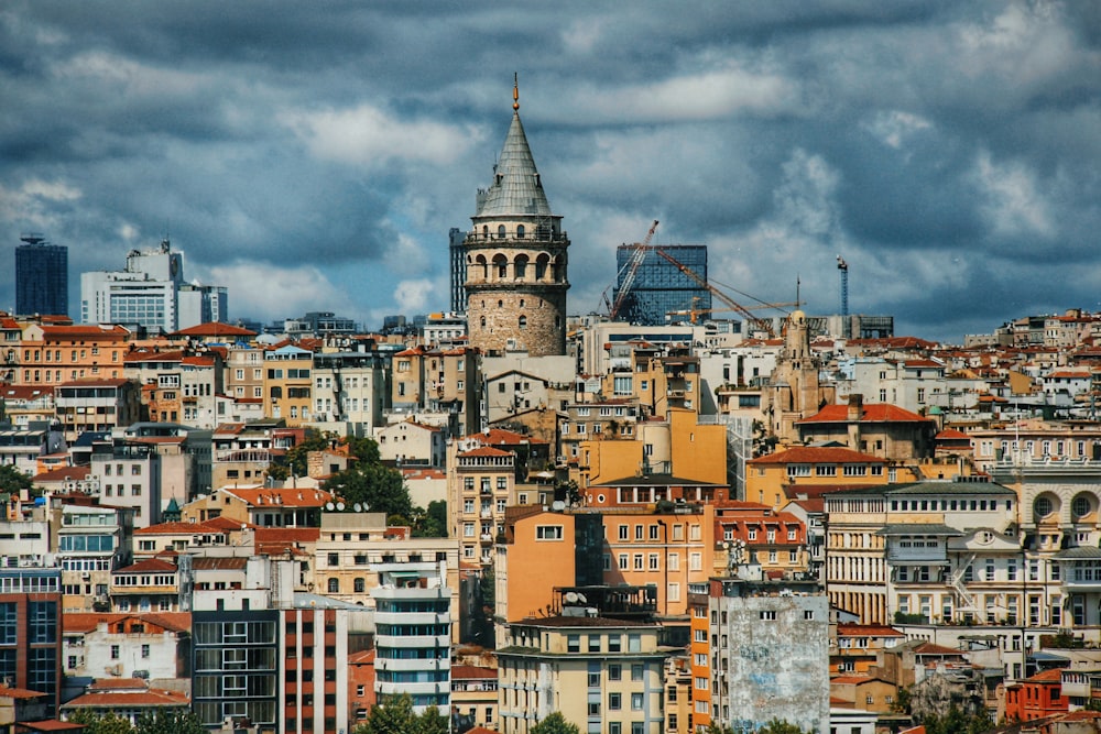 white and brown concrete building under cloudy sky during daytime