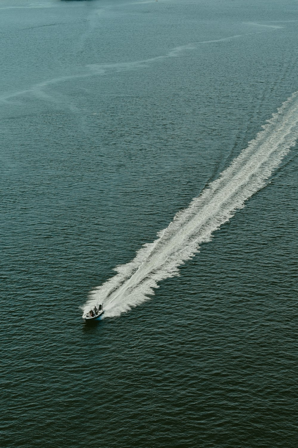 white passenger plane on the ocean during daytime