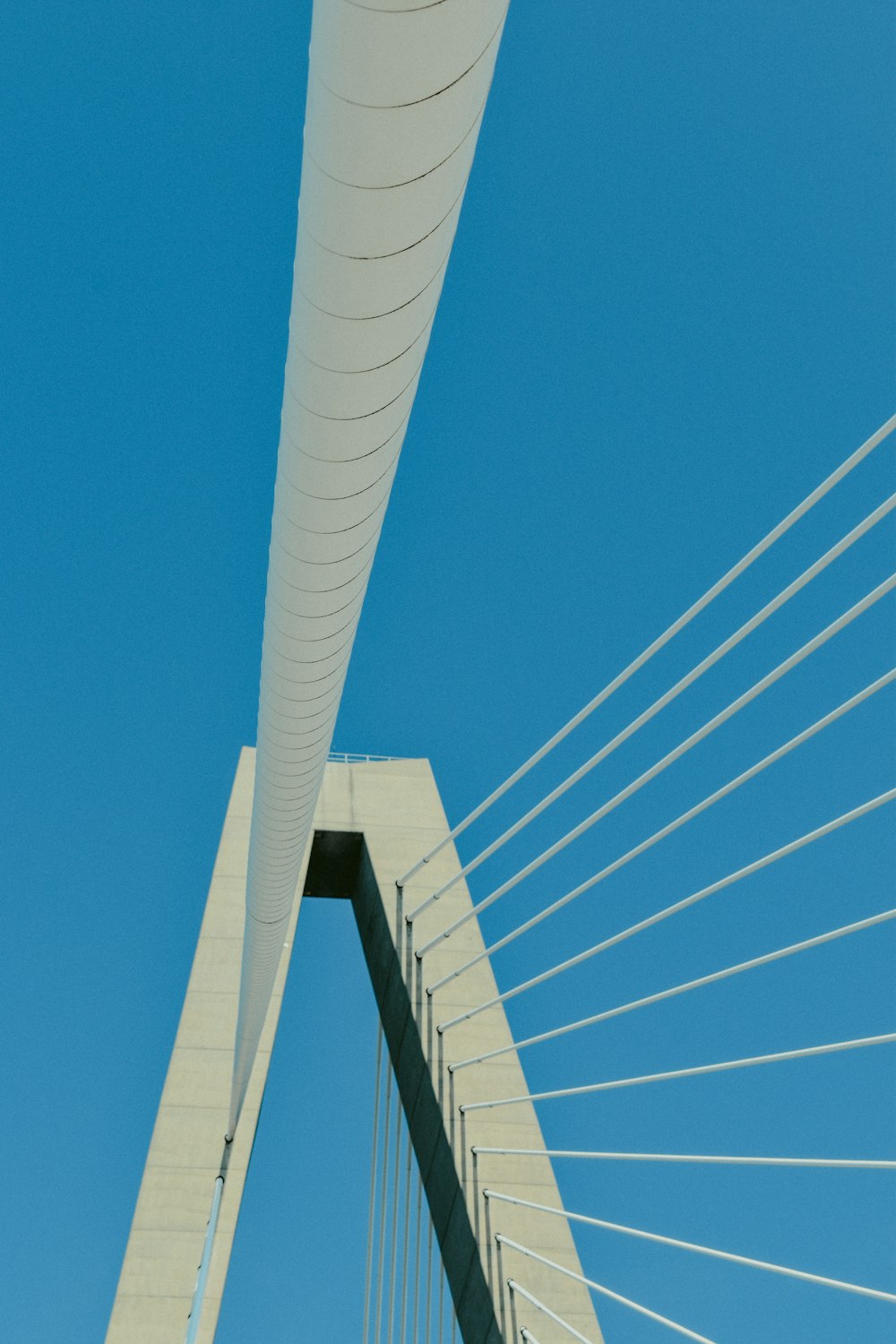 white metal bridge under blue sky during daytime