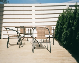 black metal framed white wooden table and chairs