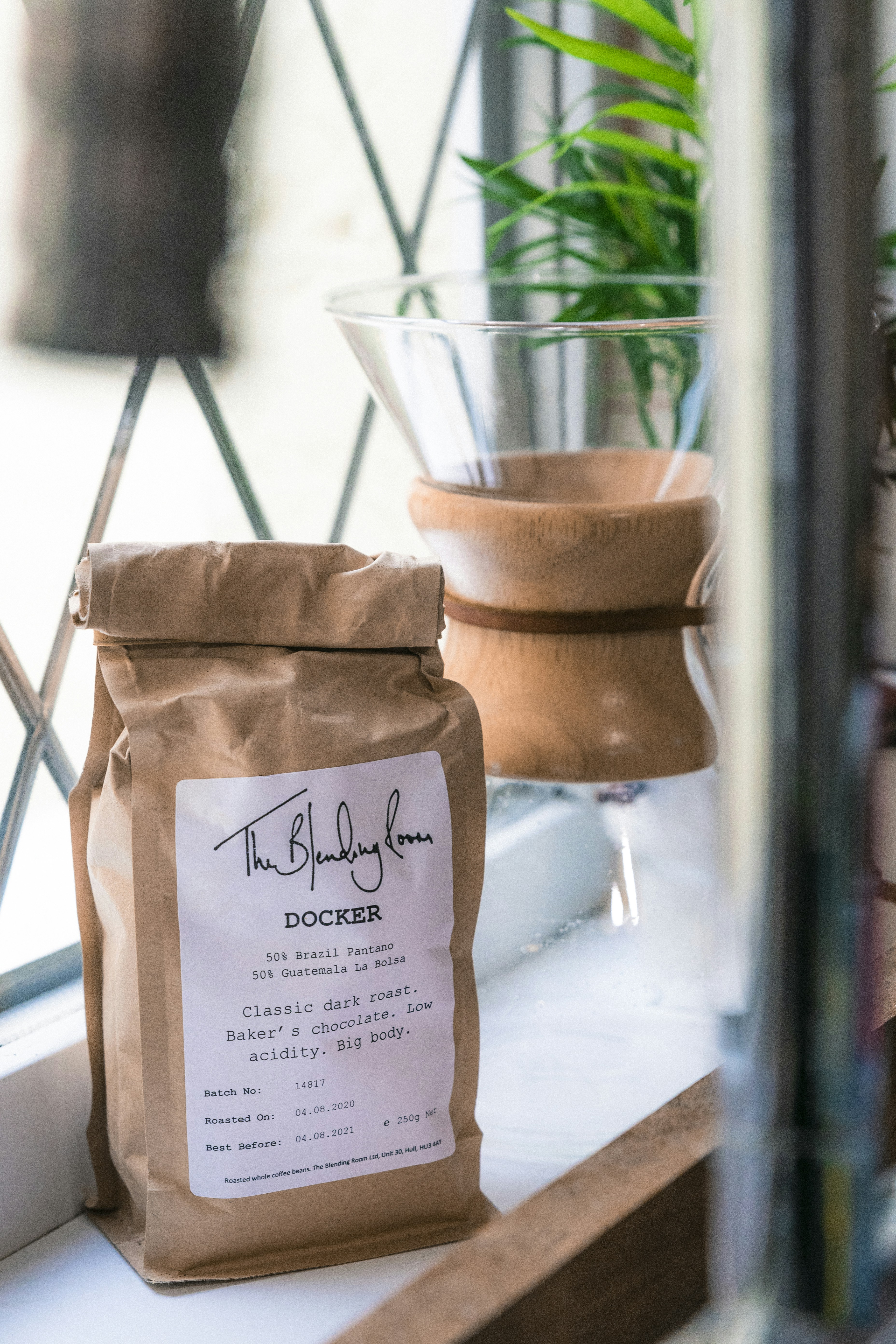 brown leather sling bag on glass table