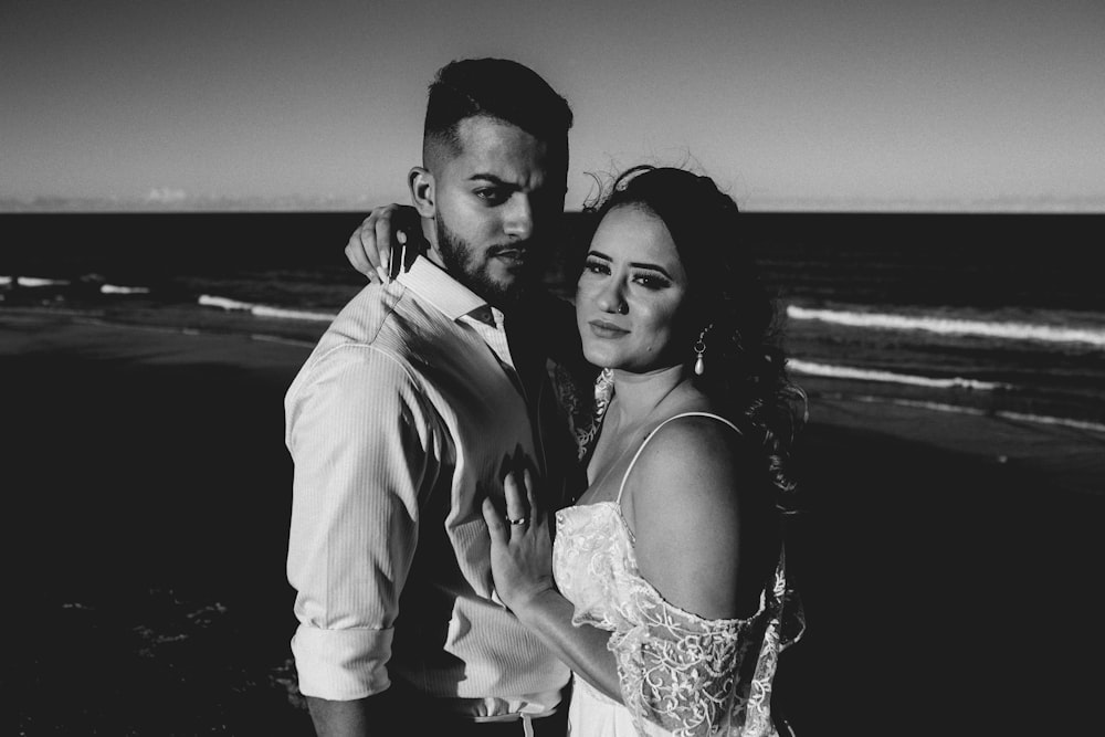 grayscale photo of man and woman smiling