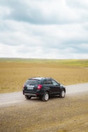 black suv on road during daytime