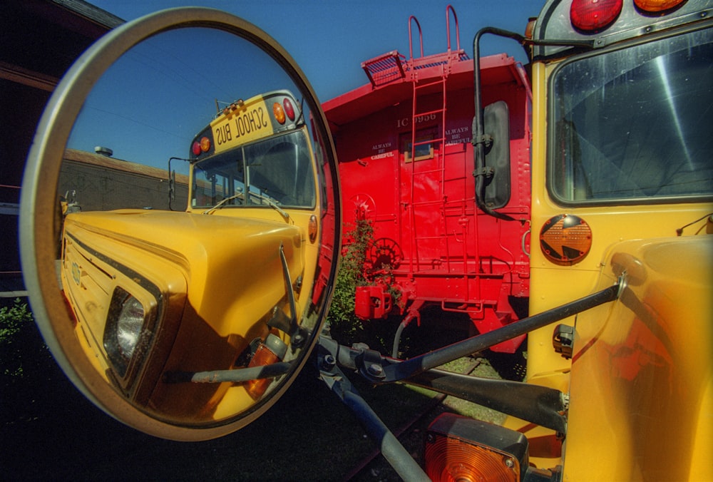 red and yellow auto rickshaw