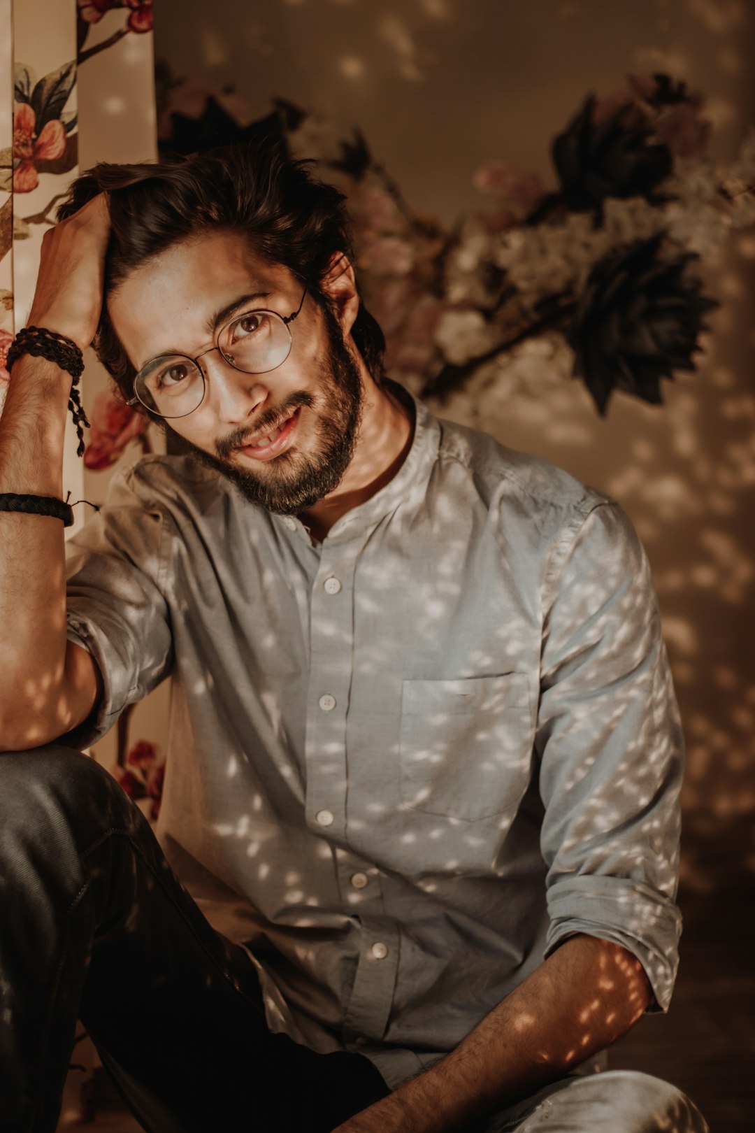 man in blue dress shirt wearing black framed eyeglasses