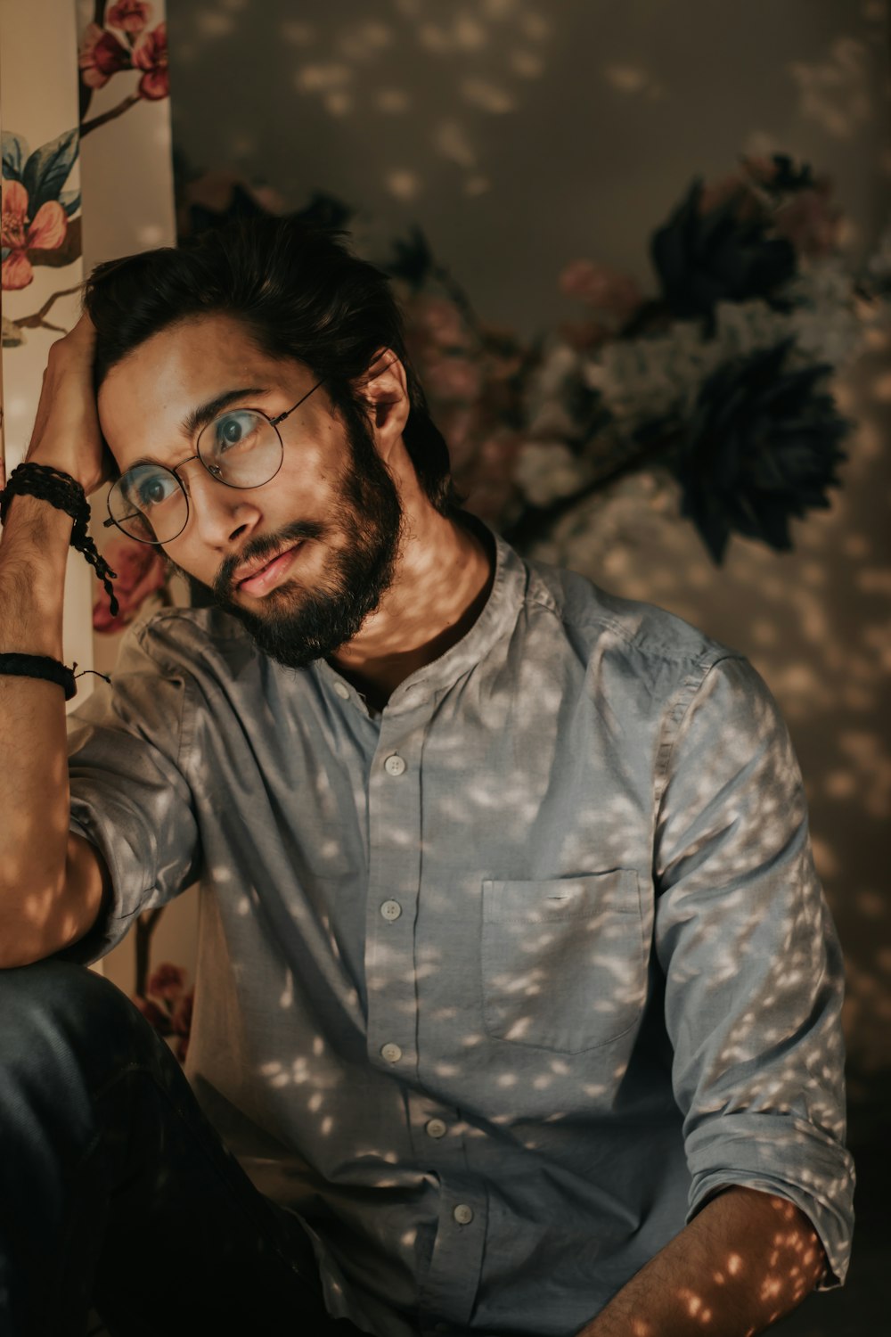 man in blue and white button up shirt wearing black framed eyeglasses