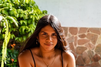 woman in black spaghetti strap top
