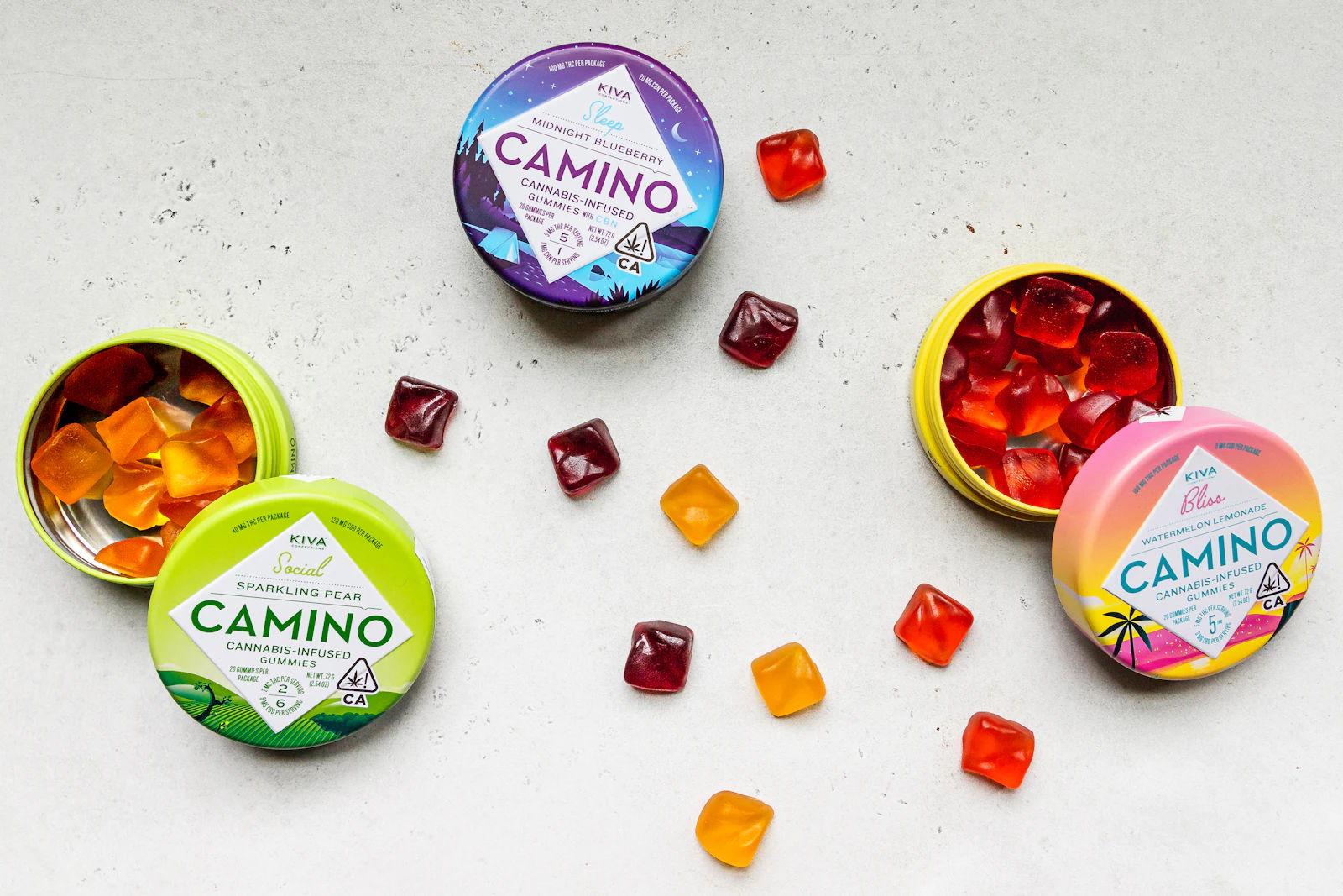 Licensed cannabis-infused gummies in labeled tins bearing the California universal cannabis symbol