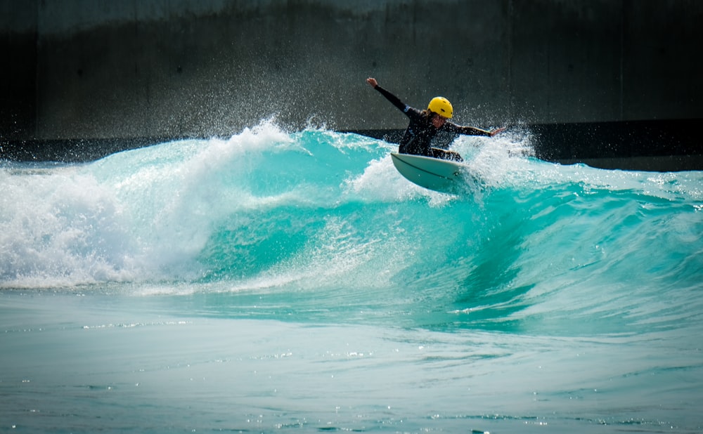 man in yellow and black kayak on blue ocean water during daytime