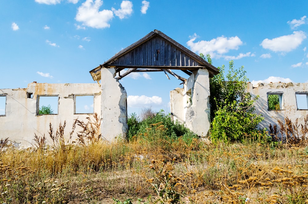 white concrete building near green grass field during daytime