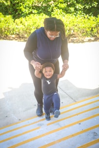 A caregiver assisting a client with walking safely through their home.