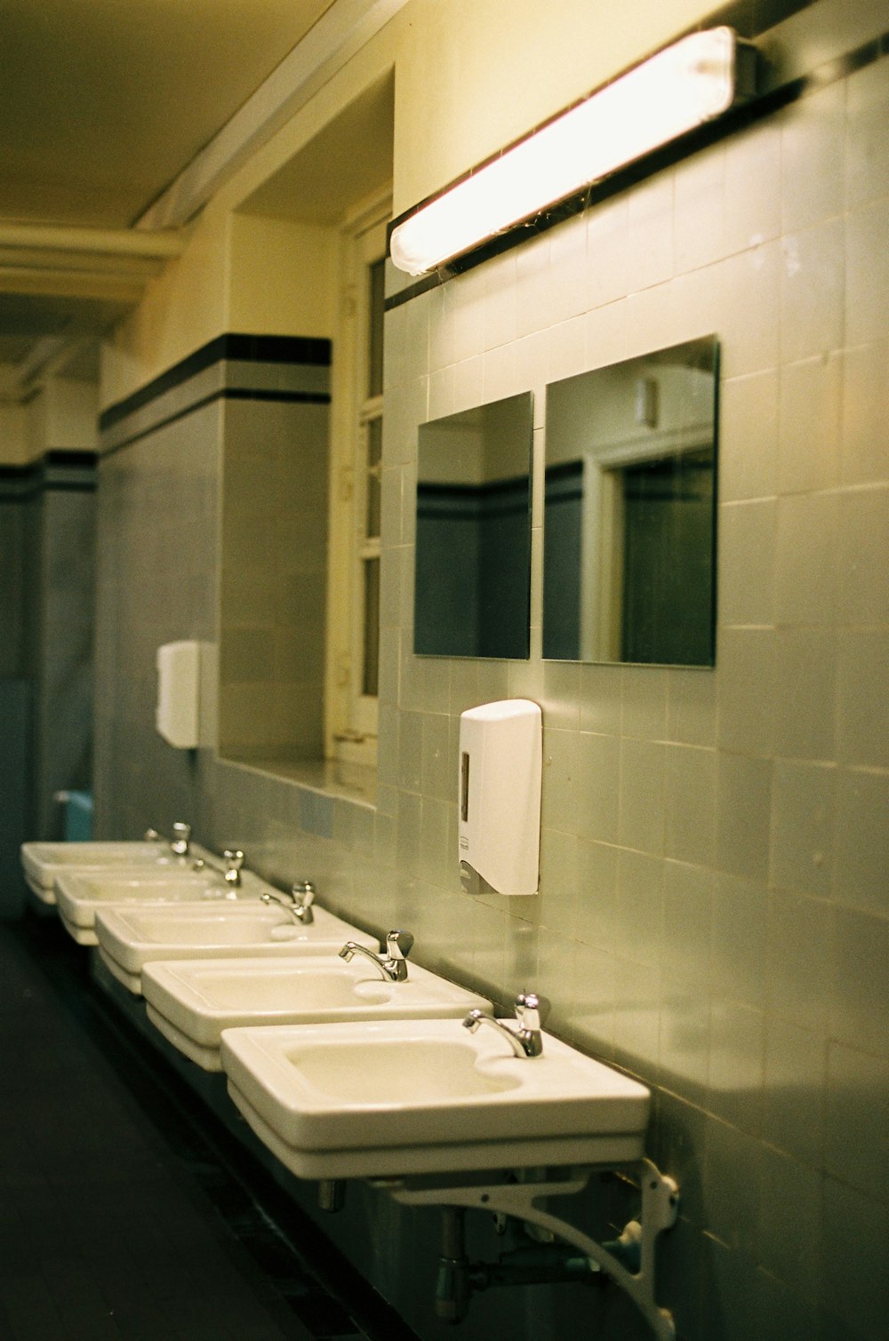 white ceramic sink with faucet