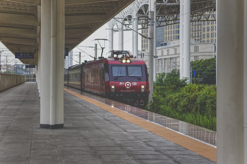 red and black train on rail during daytime