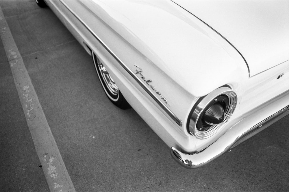 grayscale photo of car on road