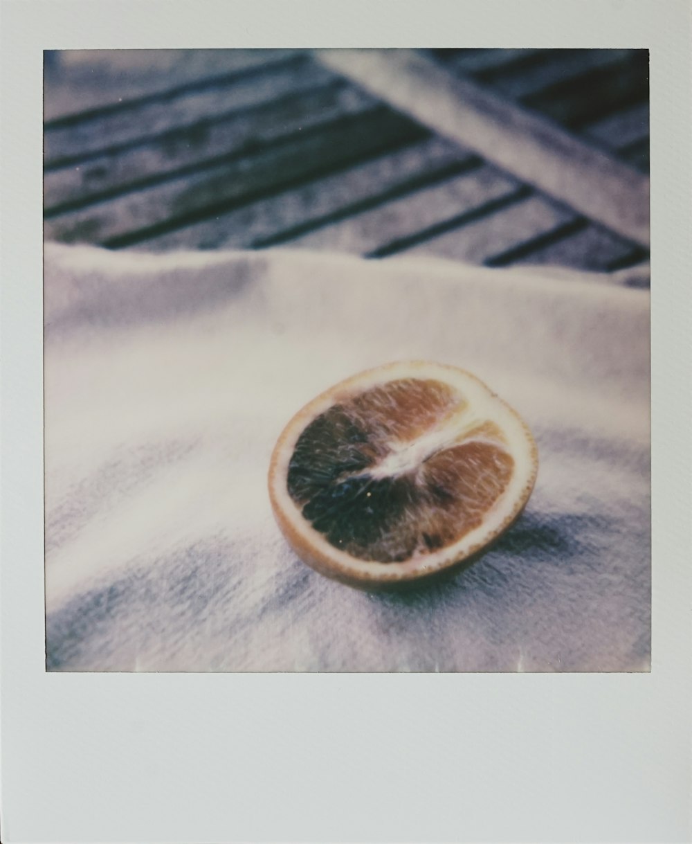 sliced lemon on white textile