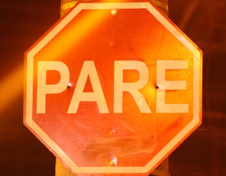 orange and white stop sign