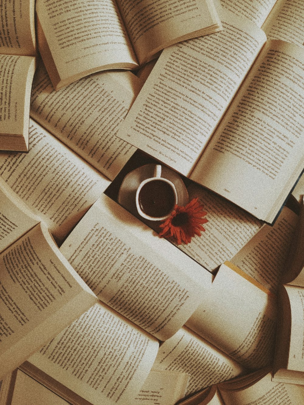 white ceramic mug on book page