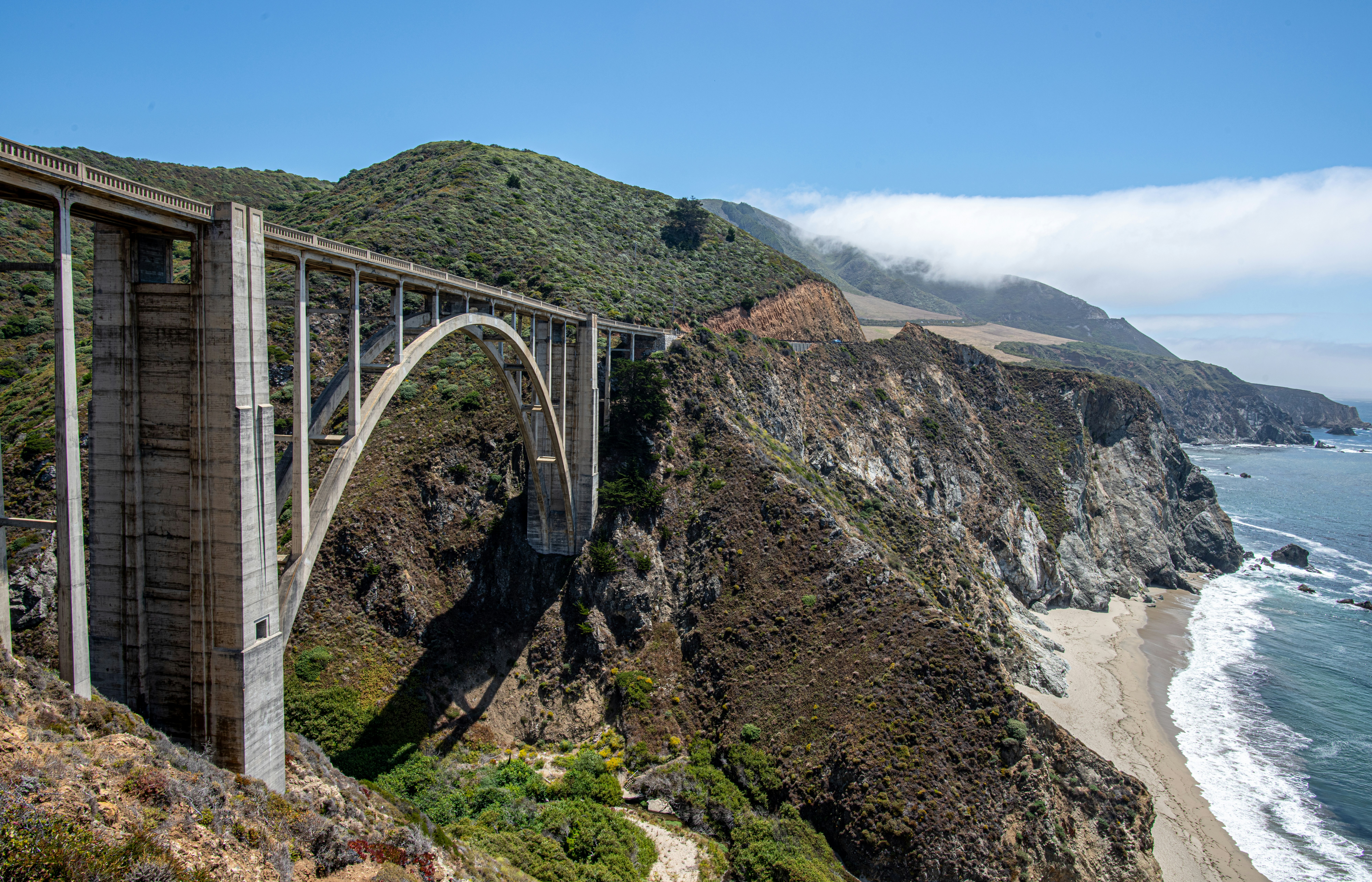 gray metal bridge over the river