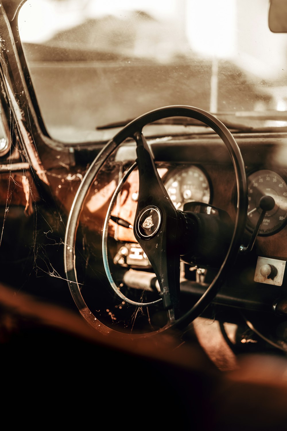 black steering wheel in close up photography