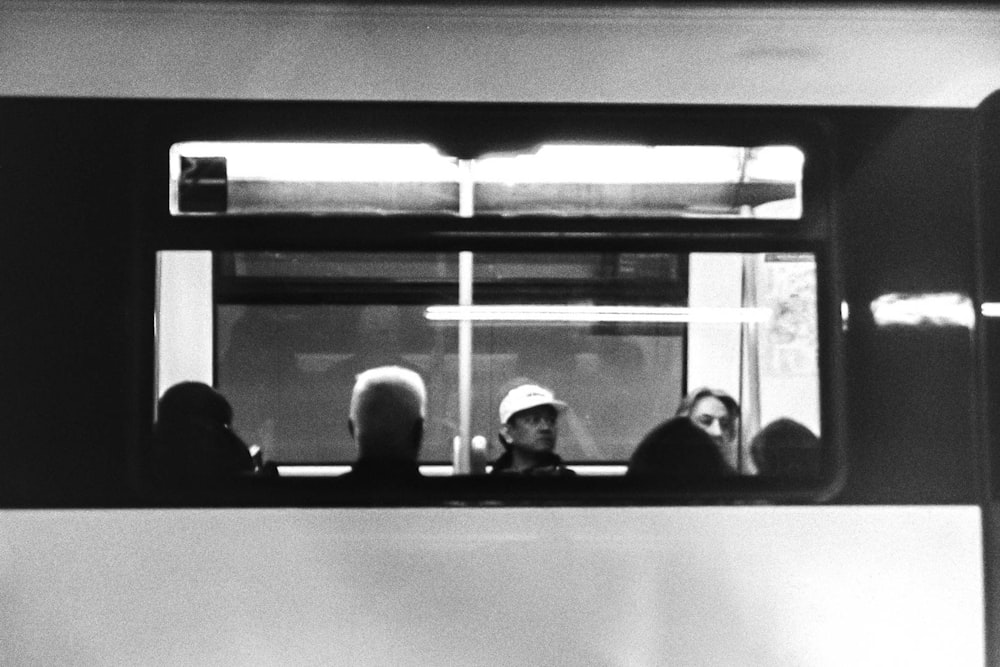 people sitting on train seat