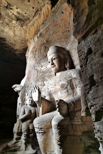 brown stone statue of man