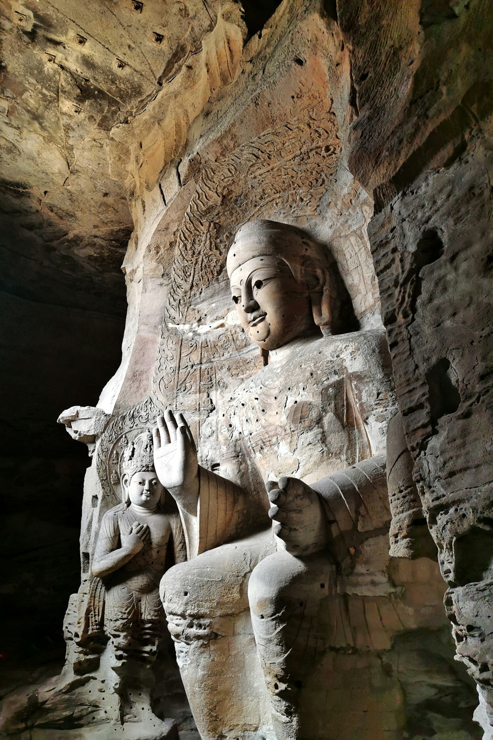 brown stone statue of man