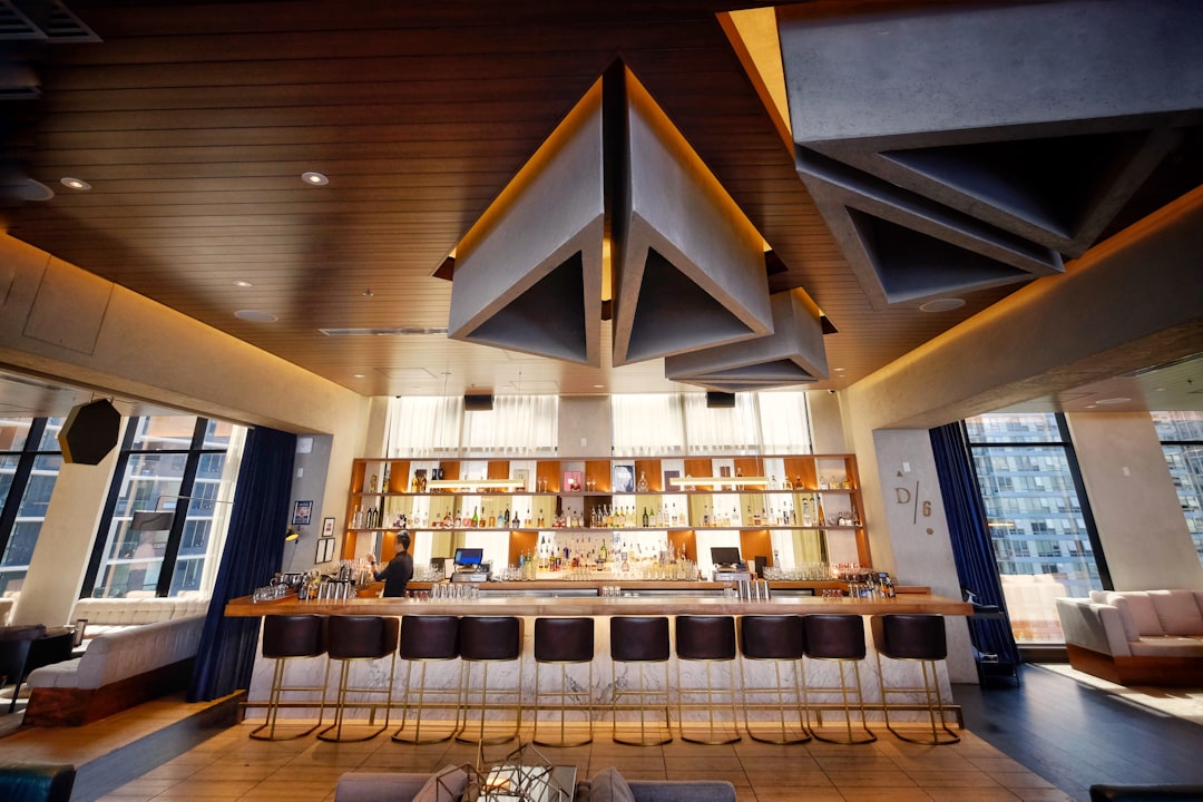 brown wooden table and chairs, The D/6 bar in Vancouver