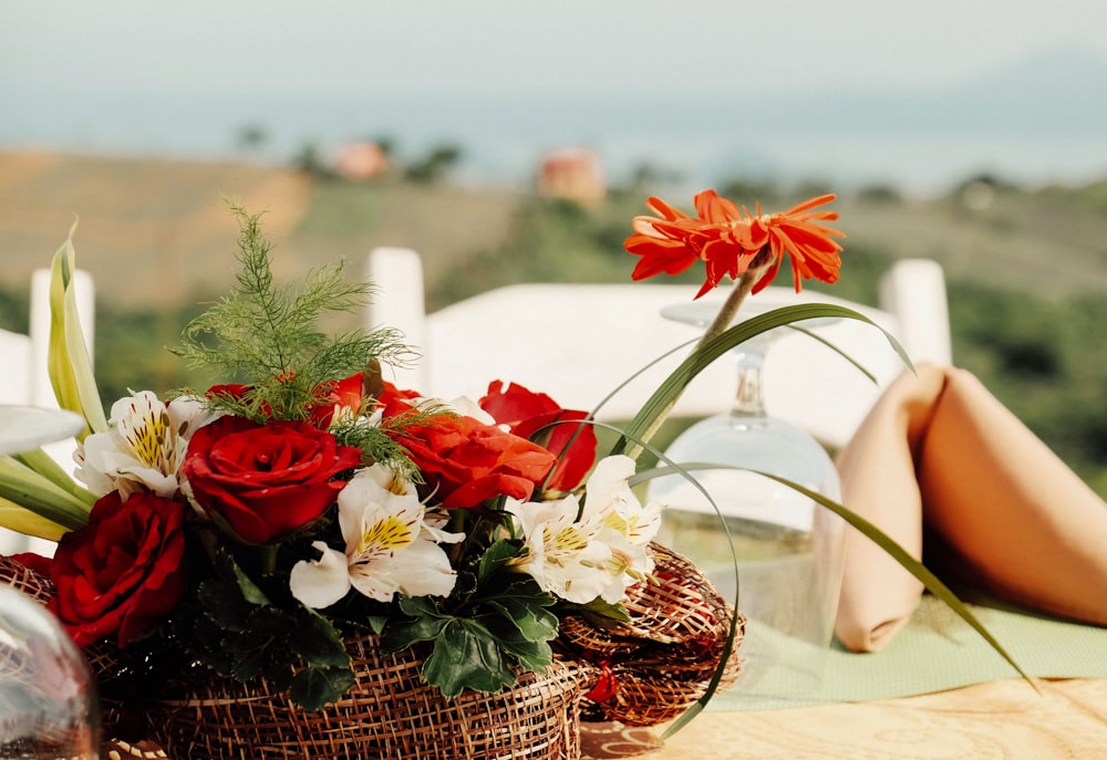 red and white flowers on brown woven basket