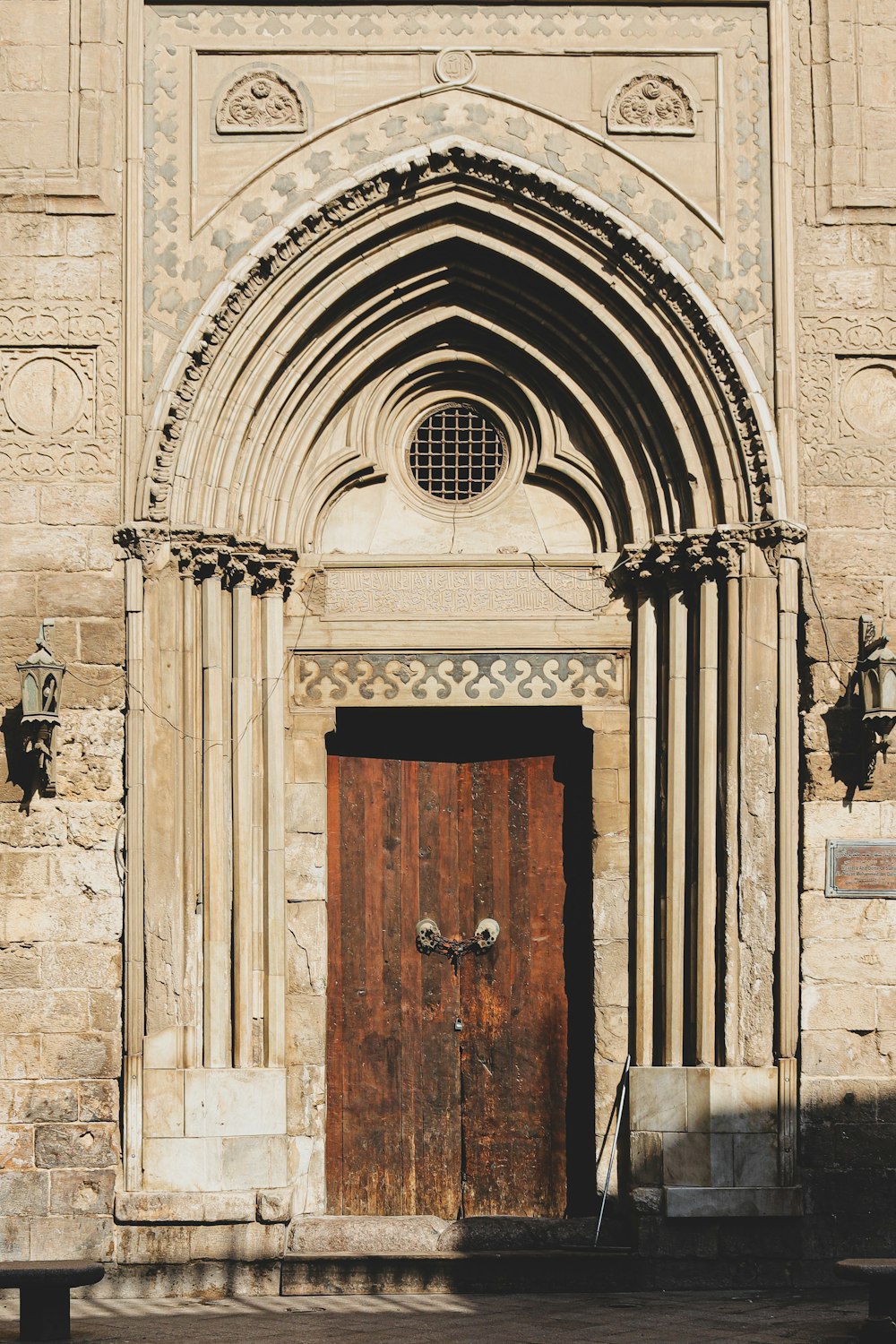 brown wooden door on gray concrete building