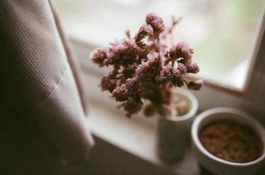 A delicate sprig of lavender resting on a soft linen cloth, bathed in gentle morning light.