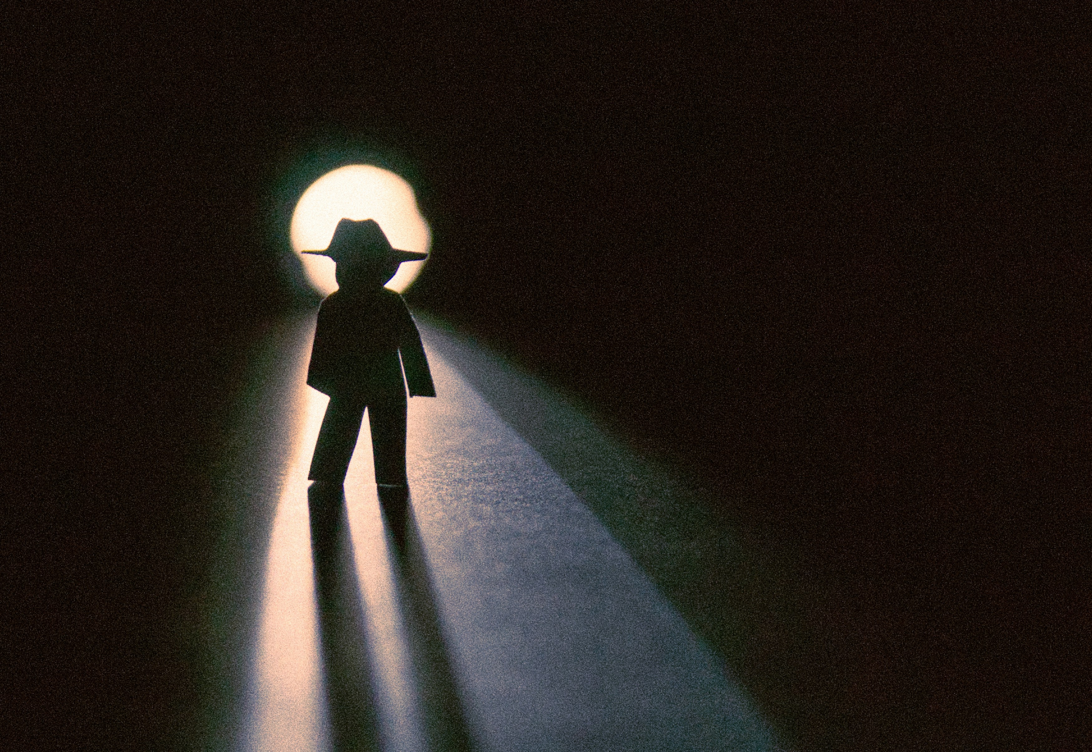 a person standing in the middle of a dark room