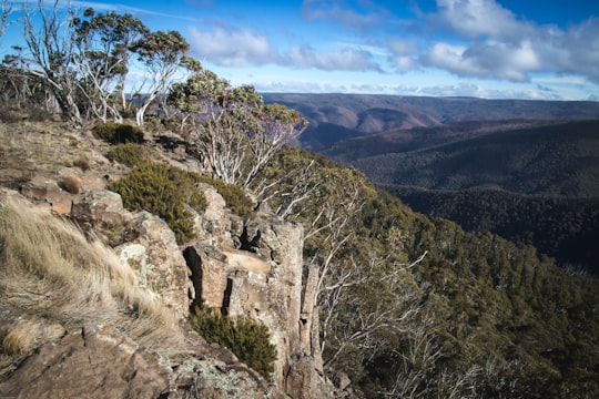 brown rocky mountain under blue sky during daytime in Dinner Plain VIC Australia