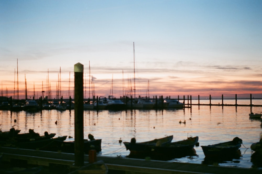 boat on dock during sunset