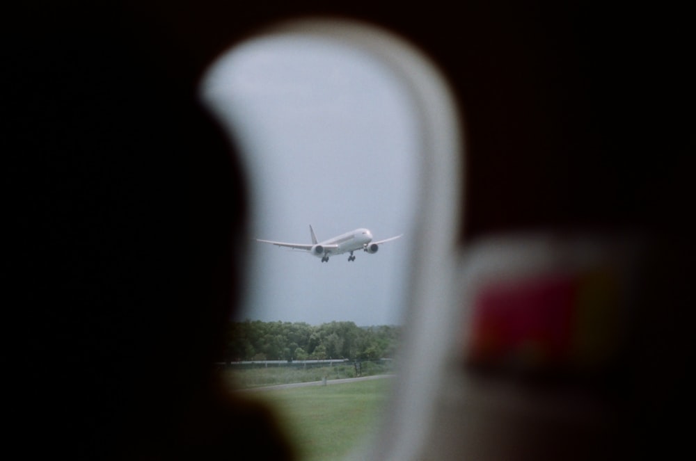 white airplane on the road during daytime