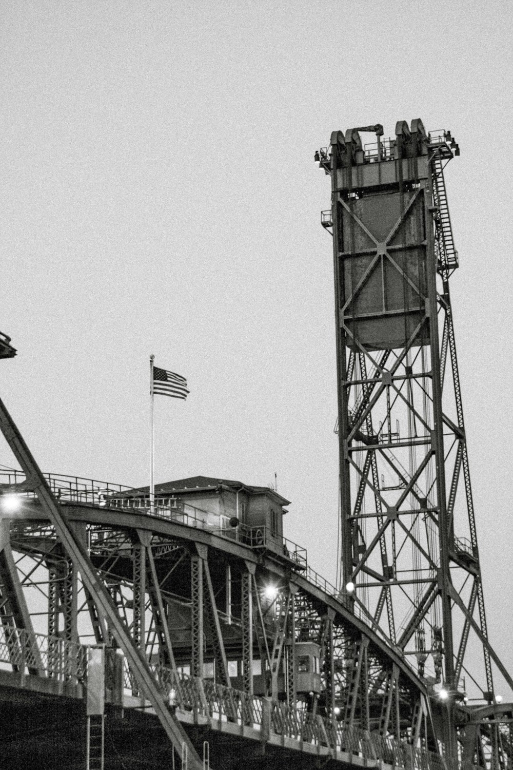 brown metal tower under gray sky