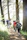 Guests walking along a forest trail during the forest train hike, surrounded by tall trees and dappled sunlight.
