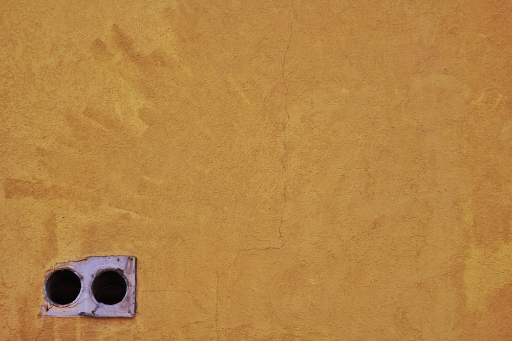 brown concrete wall with hole