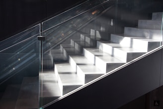 Modern concrete staircase with natural light.