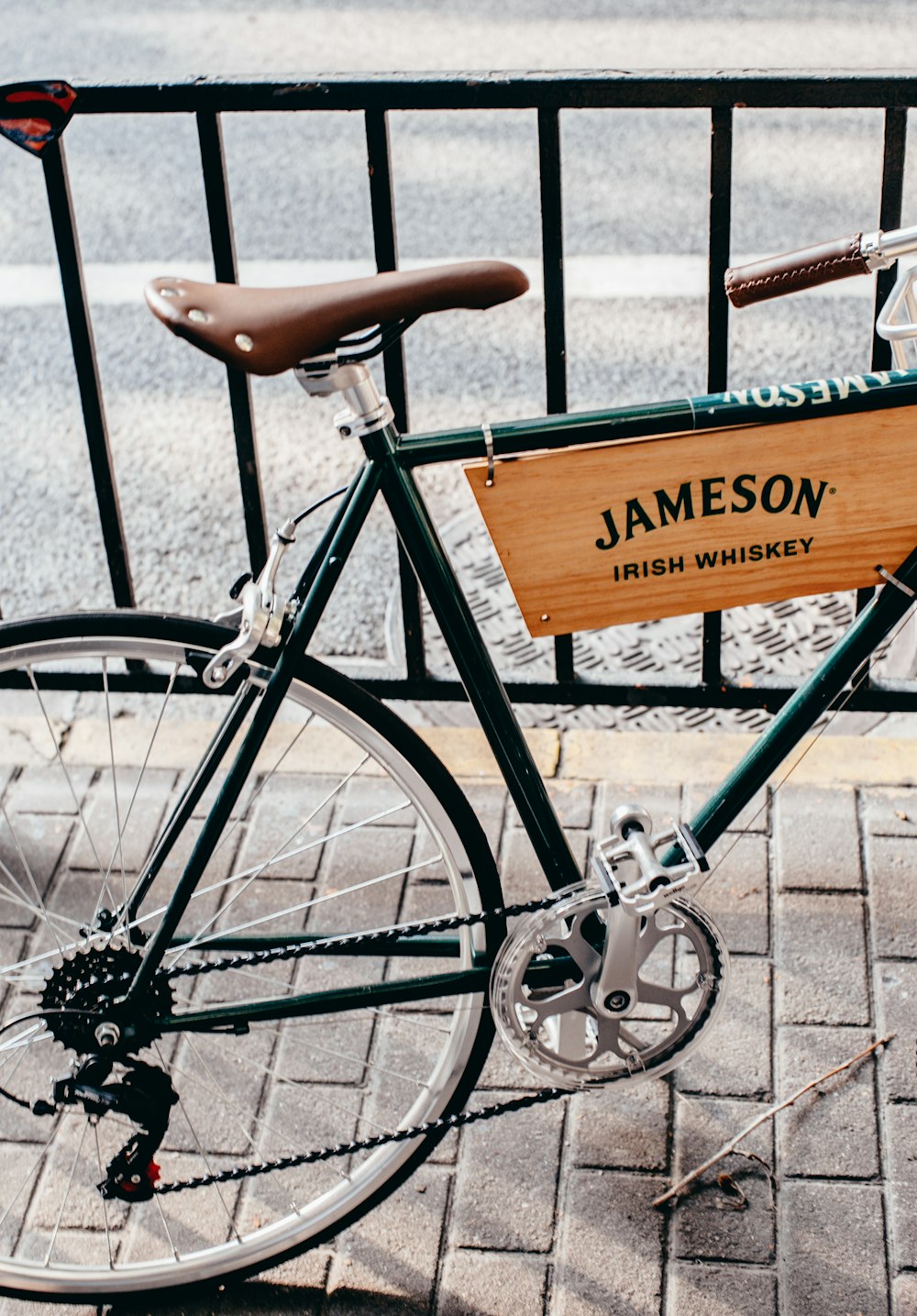 black bicycle with brown wooden board