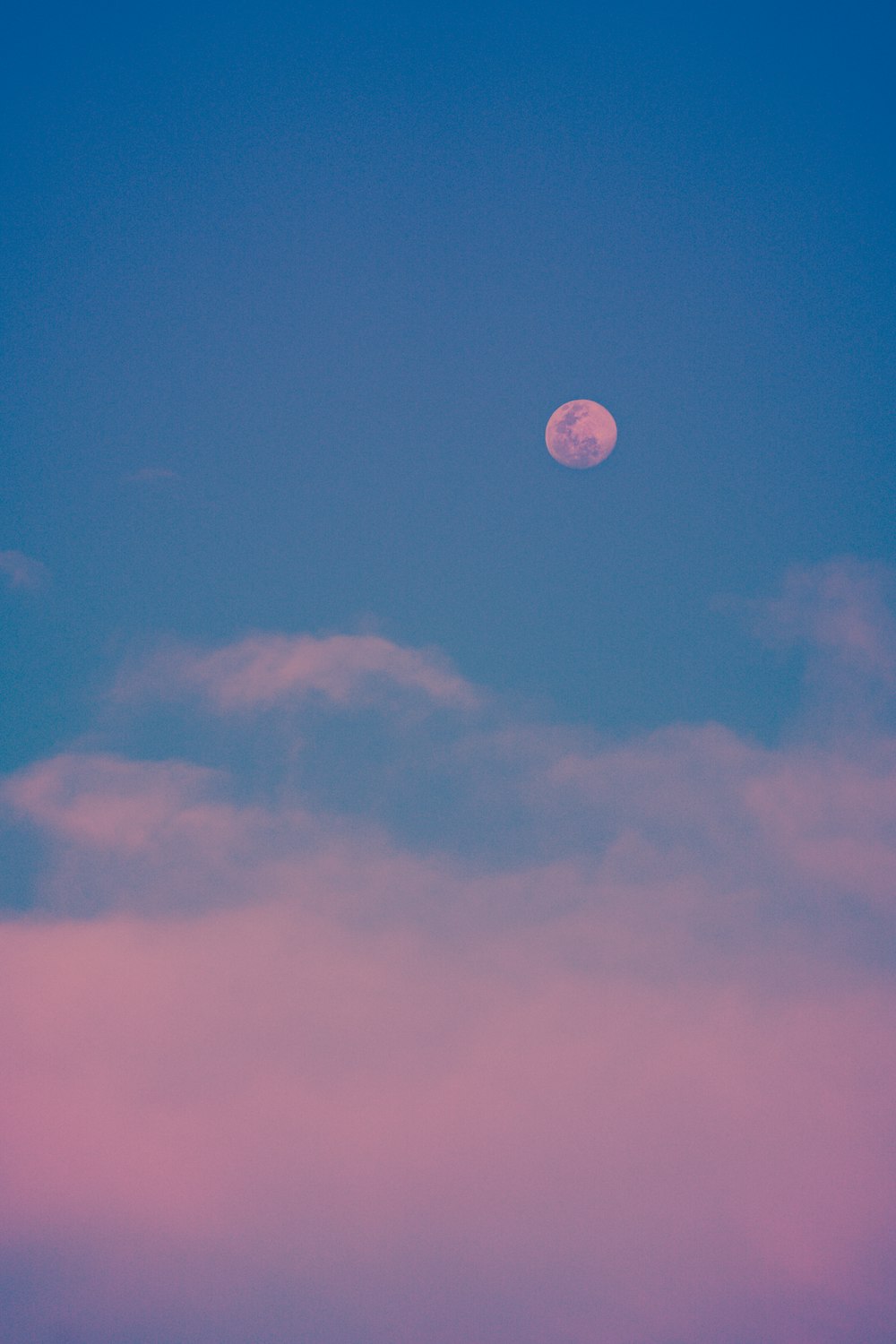 full moon in blue sky