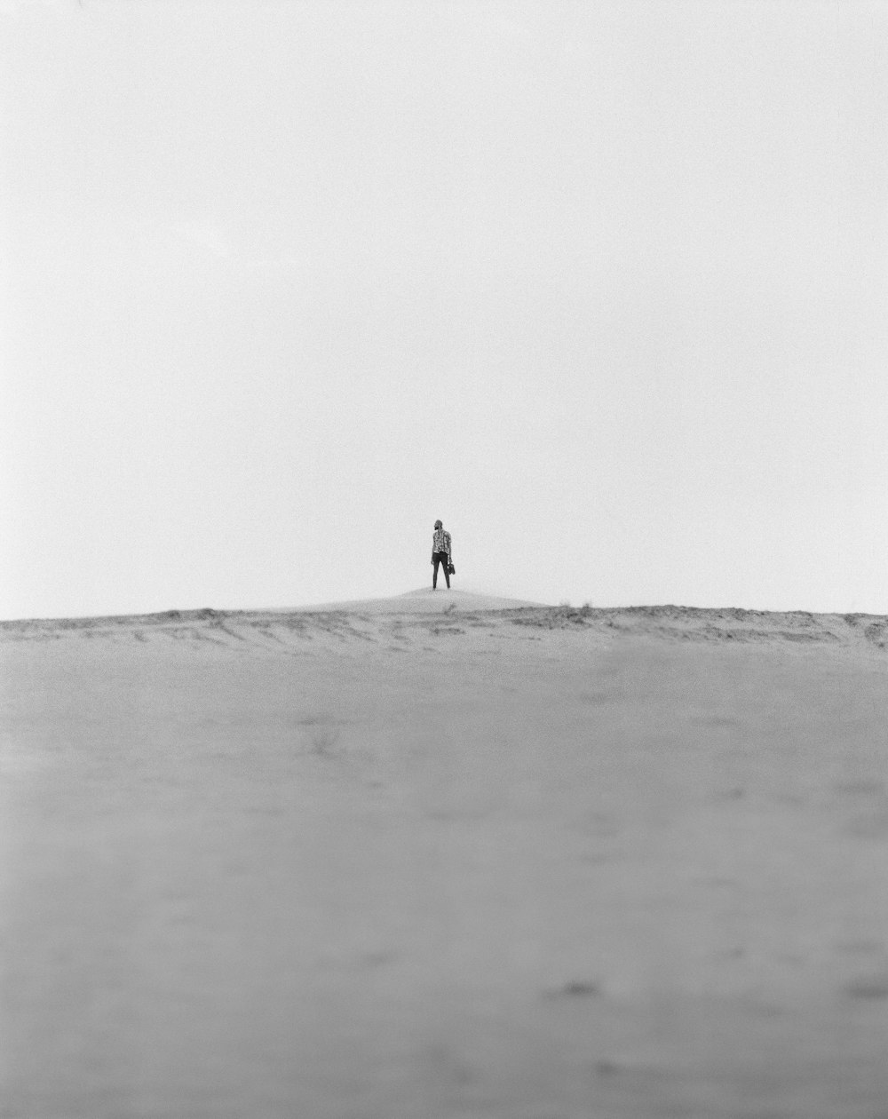 person walking on the beach