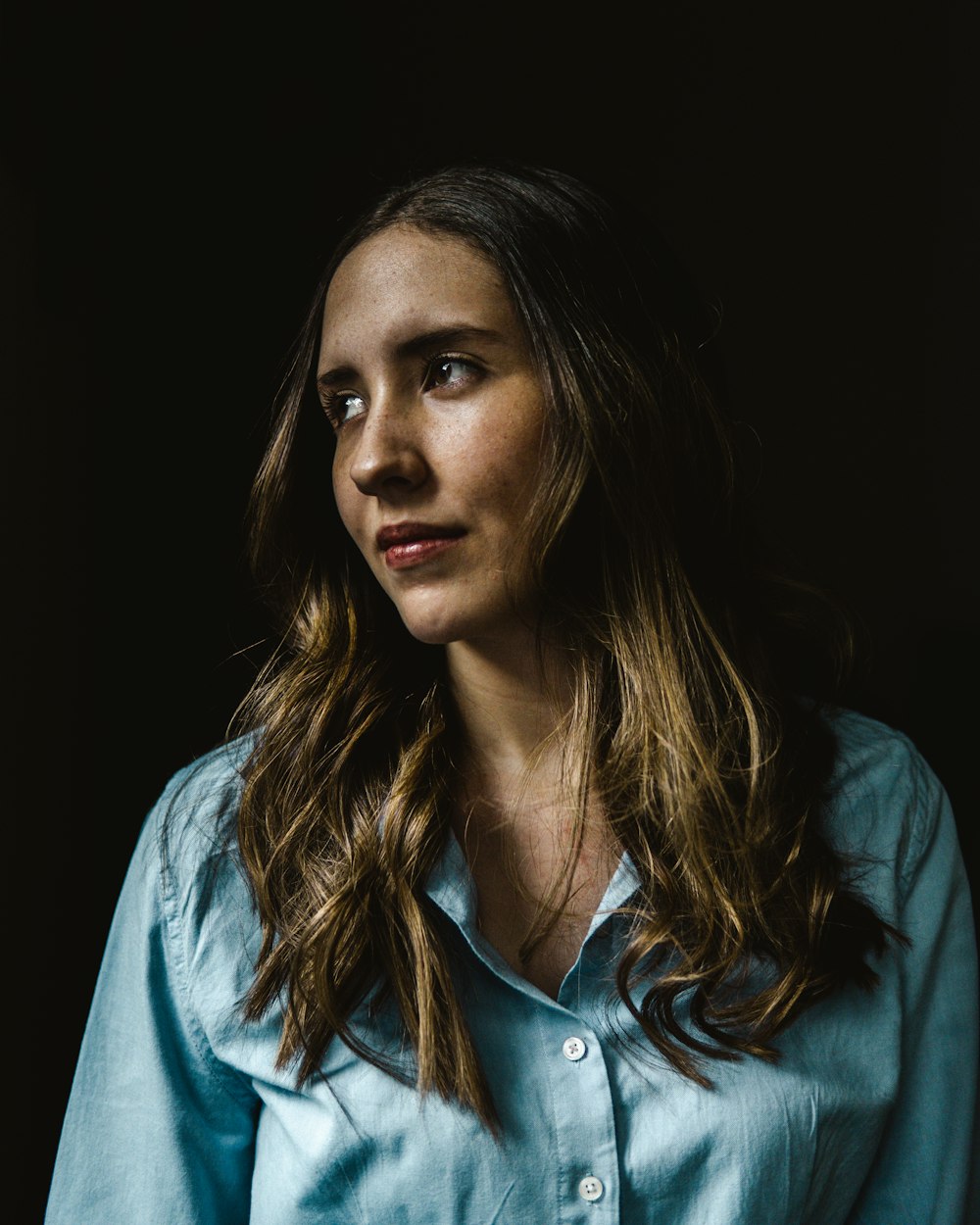 woman in blue button up shirt