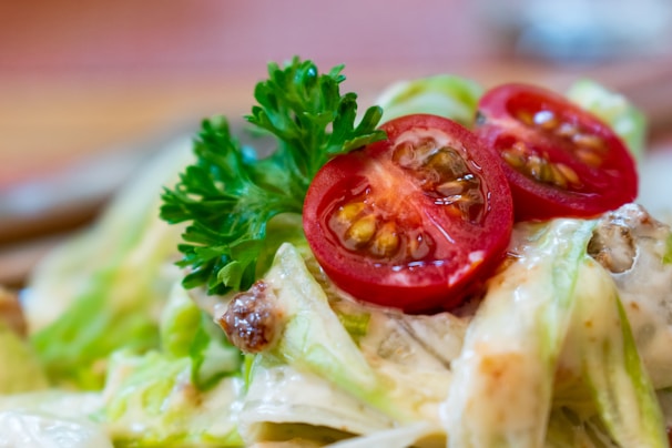 Close-up of vibrant green salad with cherry tomatoes and avocado slices